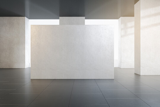 Modern concrete gallery interior with abstract city view, daylight and mock up place on wall. Exhibition and art concept. 3D Rendering.