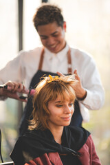 Fototapeta premium concept of professional fashion hairdresser and hair beauty salon, hairstylist making treatment to woman client person, by using scissors for haircut and coiffure care, girl style in studio lifestyle