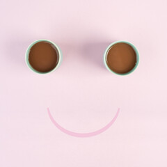 Cup of coffee building the eyes of the funny face, mouth is smiling, wake up in the morning, hot...