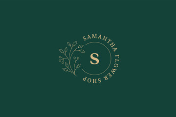 Botanical monochrome circle frame with letter spring organic blossom design line art logo vector