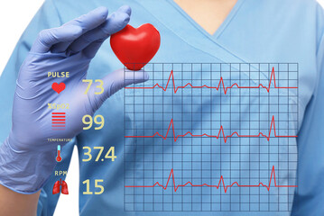 Closeup view of doctor holding red heart and illustration of cardiological diagnostic app interface