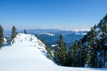 The Caprathian mountains range seen in winter from the peaks of the Piatra Mare massif in Romania , Eastern Europe.
