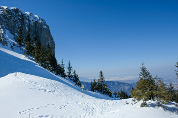Snowy peaks of the Piatra Mare mountains , part of the Carpathian range in Romania , wintertime landscape.