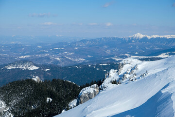 Wintertime landscape in the Piatra Mare massif , part of the Carpathian mountain range in Romania 