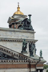Fototapeta na wymiar Details of the eastern facade of St. Isaac's Cathedral in St. Petersburg, bronze sculptures, St. Isaac of Dalmatia stops Emperor Valens