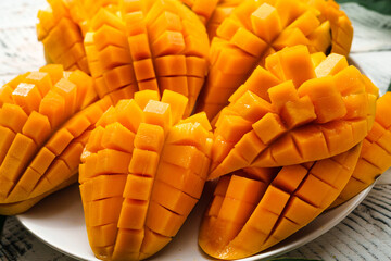 mango fruit,fresh yellow mango on white wood