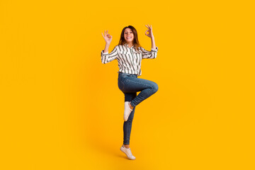 Fototapeta na wymiar Full size profile side photo of young lady jump up show fingers okey symbol promo isolated over yellow color background