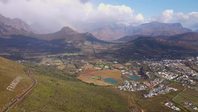 Flight along Franschhoek pass showing the town, vineyards on farms and mountains