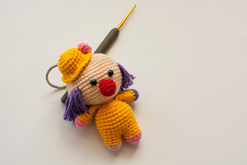 amigurumi keychain on white background.