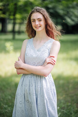 Portrait of a young smiling girl in the park.