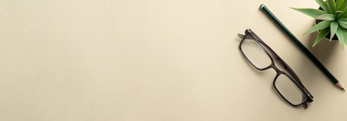Office desk with copy space. home office. Glasses and pen on office desk top view. banner