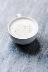 Coffee with milk on wooden background. Soft focus. Close up. Copy space.                              