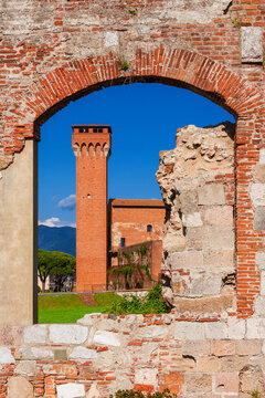 Pisa 'Old Citadel' medieval tower, seen through city walls ruins