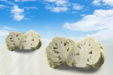 Digital synthesis creative image of Cauliflower  with blue sky background