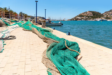 Fishing nets on the pier. Embankment in Port d’Andratx