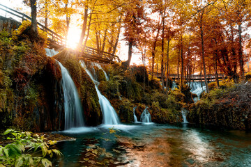 Autumn landscape with waterfalls on Pliva river near Jajce city. Bosnia and Herzegovina.
