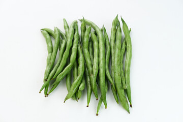 Buncis or Fresh raw string bean, legumes contain protein on white background.

