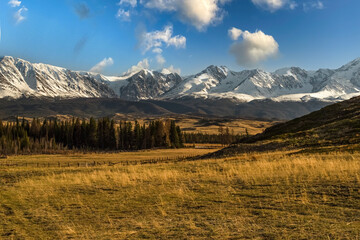 Fototapeta na wymiar North Chuya Ridge. Evening sky with beautiful clouds. Kurai steppe. Altai Mountains, Russia