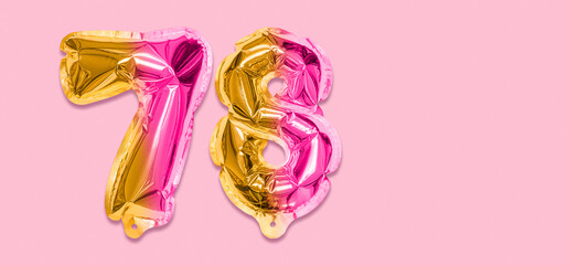 Rainbow foil balloon number, digit seventy eight on a pink background. Birthday greeting card with inscription 78. Top view. Numerical digit. Celebration event, template. Banner