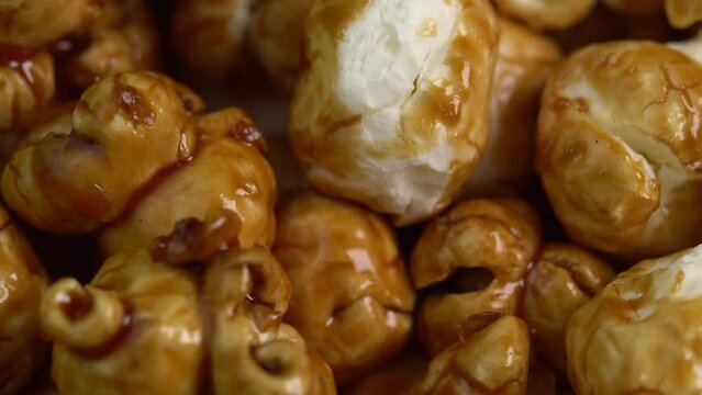 Coffee taste popcorns rotating in macro. Caramel popcorn. Healthy food for morning breakfast. Healthy breakfast concept. High quality 4k footage