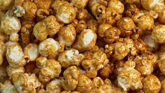 Coffee taste popcorns rotating close up. Caramel popcorn. Healthy food for morning breakfast. Healthy breakfast concept. High quality 4k footage