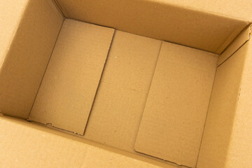 Open empty brown cardboard box background top view