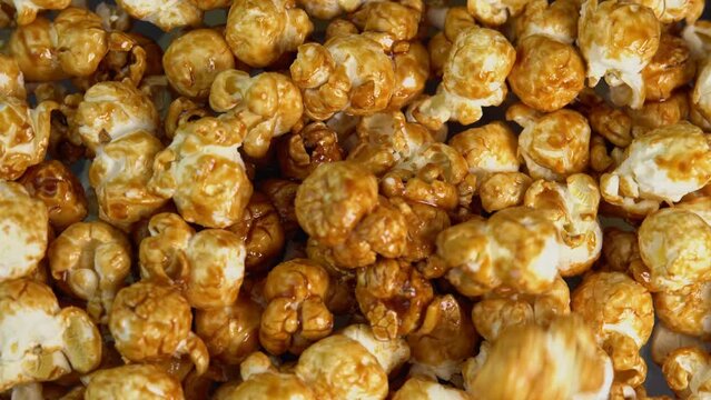 Coffee taste popcorns falls close up. Caramel popcorn. Healthy food for morning breakfast. Healthy breakfast concept. High quality 4k footage