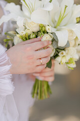 wedding bouquet in hands of the bride