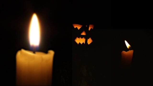 Halloween pumpkin glows surrounded by burning candles