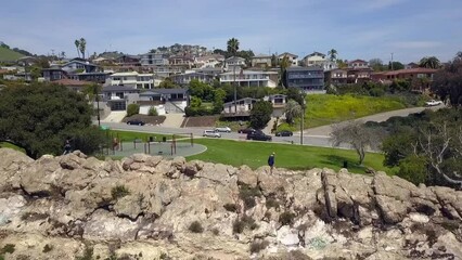 Woman walking on the cliff in front of a playground
Beautiful aerial view flight panorama curve flight drone footage
Pismo Beach California 2018. Cinematic from above Tourist Guide by Philipp Marnitz