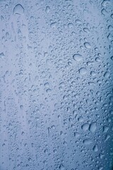 raindrops on the gray metallic surface in rainy days