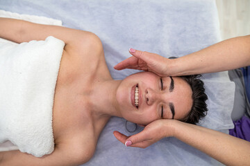 Fototapeta na wymiar face massage therapy for female client at spa clinic, all for relax