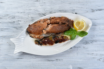 grilled fish with sun-dried tomatoes and olives
