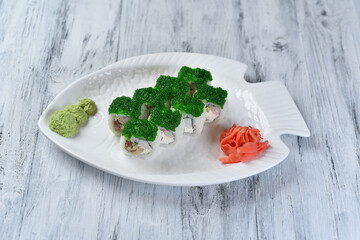 sushi, shrimp rolls, Japanese omelet, Philadelphia cheese, green tobiko caviar, ginger and wasabi