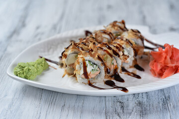 sushi, rolls with salmon, philadelphia cheese, cucumber, tuna shavings, wasabi and ginger
