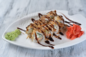 sushi, rolls with salmon, philadelphia cheese, cucumber, tuna shavings, wasabi and ginger
