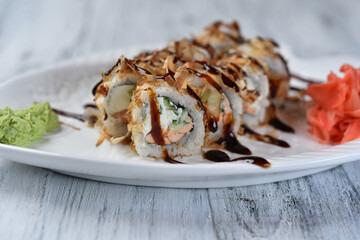 sushi, rolls with salmon, philadelphia cheese, cucumber, tuna shavings, wasabi and ginger
