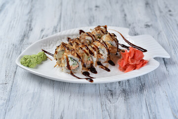 sushi, rolls with salmon, philadelphia cheese, cucumber, tuna shavings, wasabi and ginger
