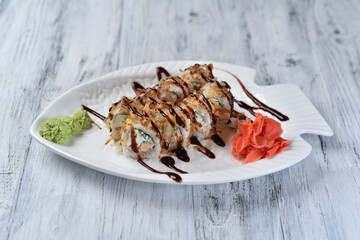 sushi, rolls with salmon, philadelphia cheese, cucumber, tuna shavings, wasabi and ginger
