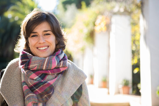 woman smiling and looking camera with copy space 