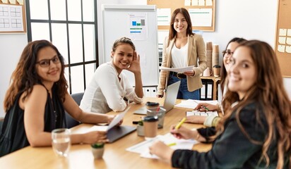 Group of young businesswomen listening boss conference during meeting at the office.