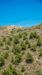 Fototapeta na wymiar Parque natural y protegido de Sierra Helada o Serra Gelada en la parte este frente a la Bahía de Altea y con el faro de Playa del Albir