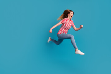 Fototapeta na wymiar Full size profile side photo of young excited woman run rush discount wear casual outfit isolated over blue color background