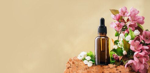 Natural medicine or aroma oil or beauty essence concept vial with dropper on stone podium stand...