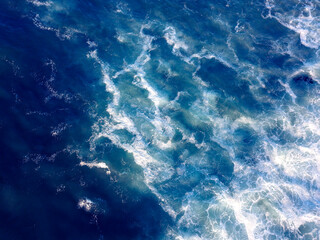 Fototapeta na wymiar Aerial view overhead waves breaking in the ocean