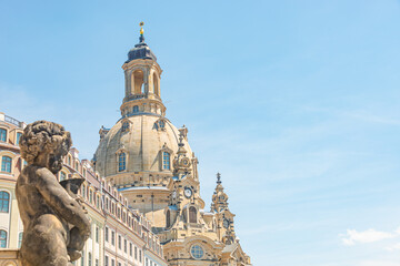 Church of Our Lady at Neumarkt square in downtown of Dresden in summer sunny day with blue sky copy space, Germany, and a statue of a child in foreground. - obrazy, fototapety, plakaty