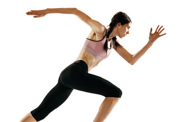 Portrait of young muscular woman running isolated on white background. One female runner or jogger. Sport, track-and-field athletics, competition concept