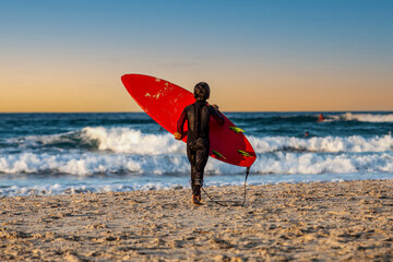 surfer boy in the beach going to the sea, Australia