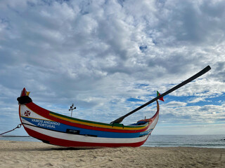 Small fishing boat on the beach. Typical boat in Portugal, Espinho.