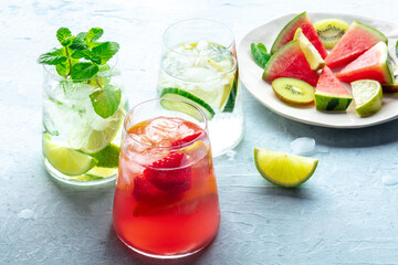 Summer cocktails. Cold drinks with fresh fruits. Healthy mocktails. Glasses of lemonade with ice and mint